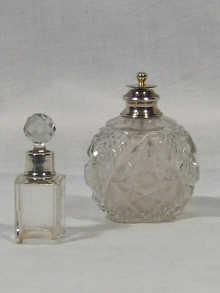 Appraisal: A cut glass silver mounted bottle marked sterling silver with