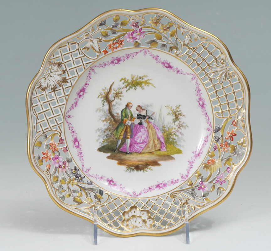 Appraisal: GERMAN RETICULATED PAINTED PORCELAIN PLATE Reticulated rim with gilt and