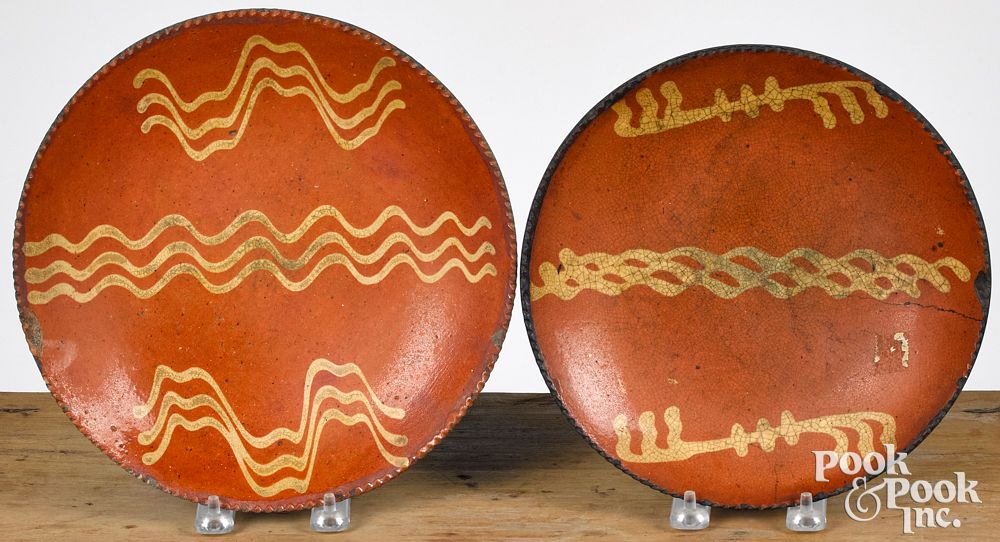 Appraisal: Two Pennsylvania redware plates th c Two Pennsylvania redware plates