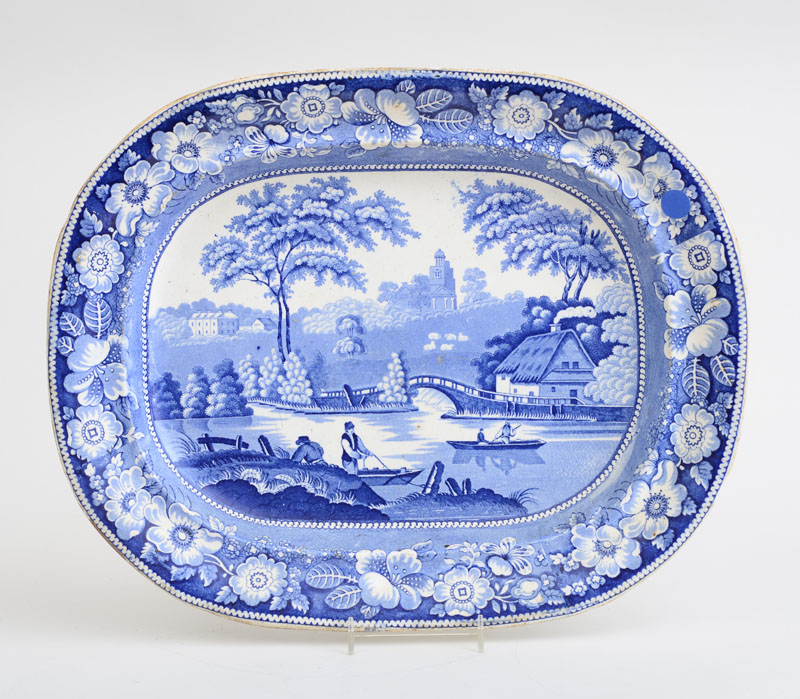 Appraisal: STAFFORDSHIRE BLUE TRANSFER-PRINTED POTTERY SCENIC PLATTER Showing a view of