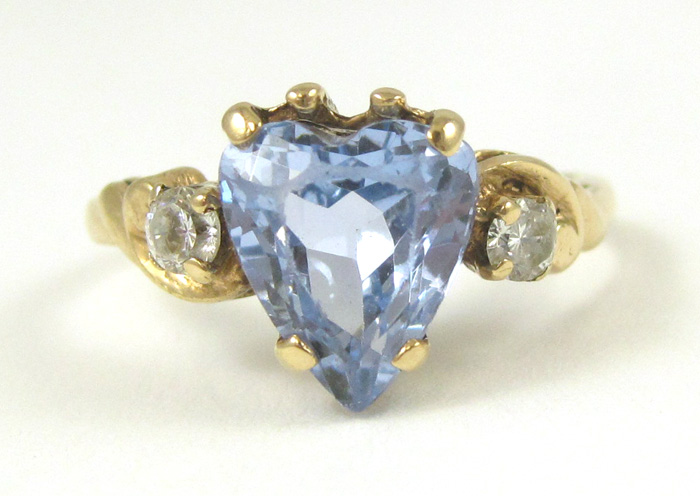 Appraisal: BLUE SPINEL AND TEN KARAT GOLD RING featuring a heart-cut