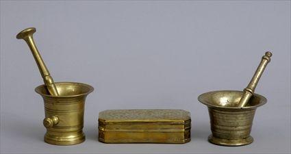 Appraisal: TWO BRASS MORTARS AND PESTLES AND A DUTCH TOBACCO BOX