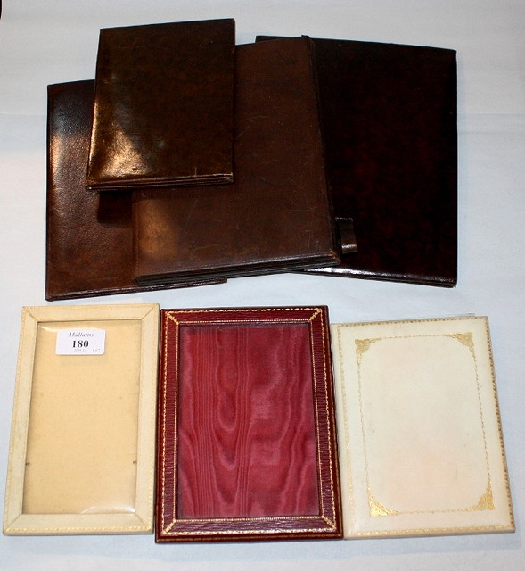 Appraisal: A LEATHER BOUND PORTRAIT FRAME high and six further photo