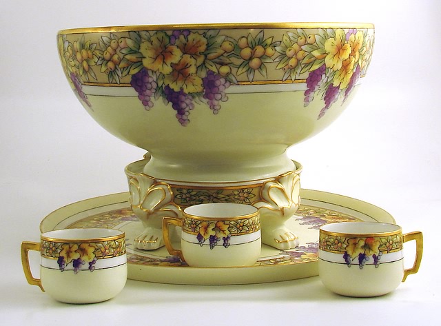 Appraisal: French porcelain punch bowl includes cups tray marked Limoges bowl