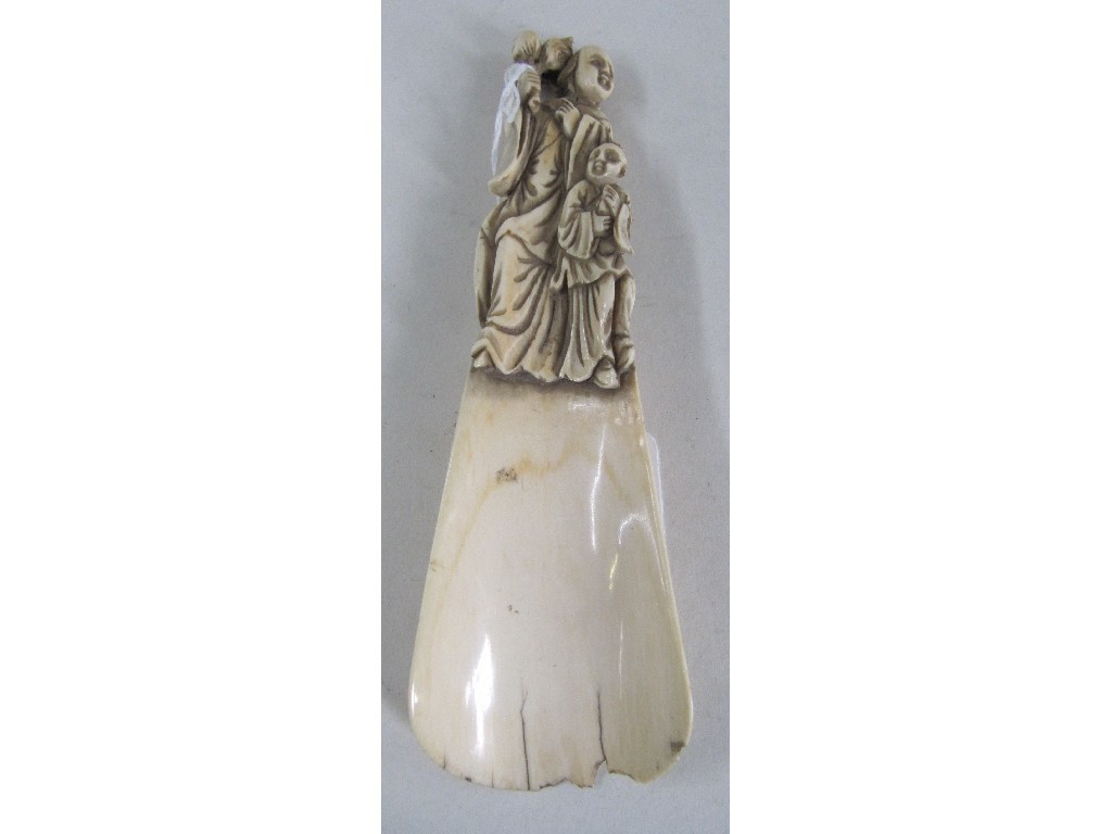 Appraisal: Carved ivory figural shoehorn