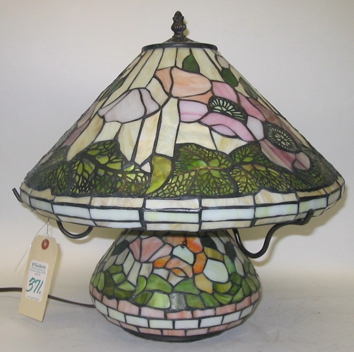 Appraisal: A STAINED AND LEADED GLASS TABLE LAMP in a dogwood