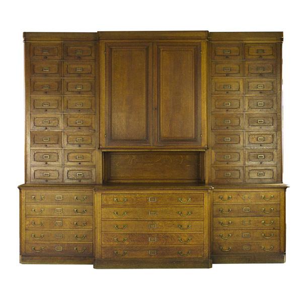 Appraisal: Oak store display case with multiple drawers ca Probably from