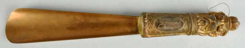 Appraisal: Figural Shoehorn with Carving Advertising Advertising for Jarman Shoes for