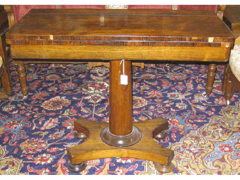 Appraisal: AMERICAN CLASSICAL REVIVAL ROSEWOOD GAMES TABLE Rectangular hinged top opens