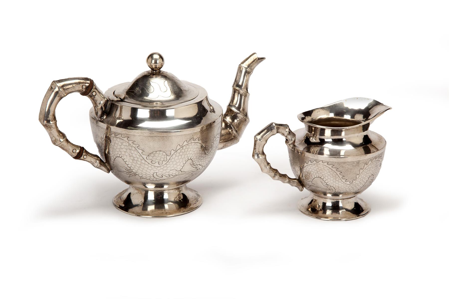 Appraisal: CHINESE EXPORT SILVER TEAPOT AND CREAMER Late th-early th century