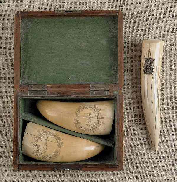 Appraisal: Pair of cased scrimshaw whale teeth th c inscribed A