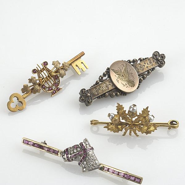 Appraisal: FOUR GOLD BAR PINS k bi-colored pin with diamonds pave