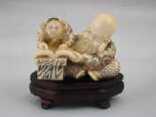 Appraisal: A signed Chinese ivory figure of a teacher with his