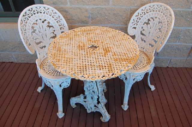 Appraisal: A VICTORIAN WHITE PAINTED CAST IRON GARDEN TABLE AND TWO