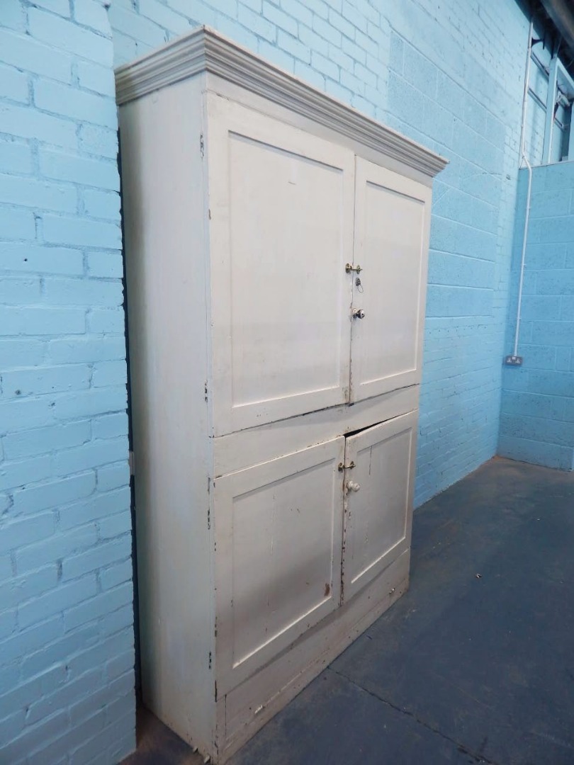 Appraisal: A Victorian pine cupboard the top with a moulded cornice