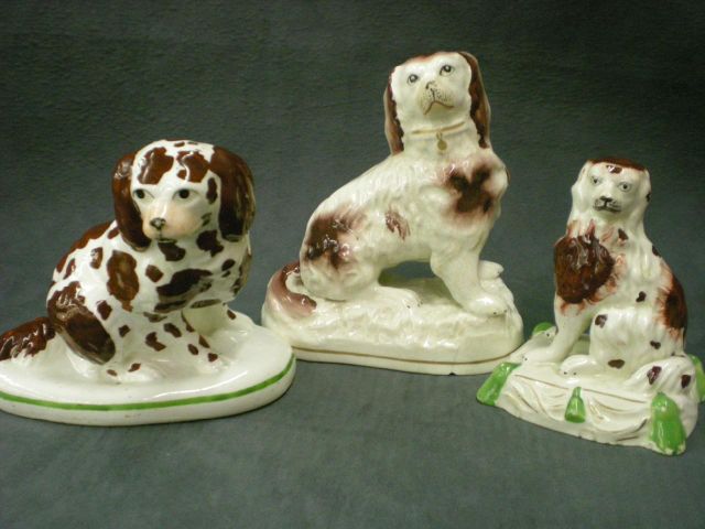 Appraisal: Staffordshire seated brown and white dog figurine slumped firing crack