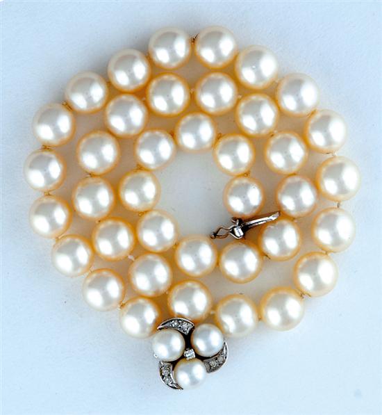 Appraisal: Strand of pearls with diamond clasp thirty-eight mm cream pearls