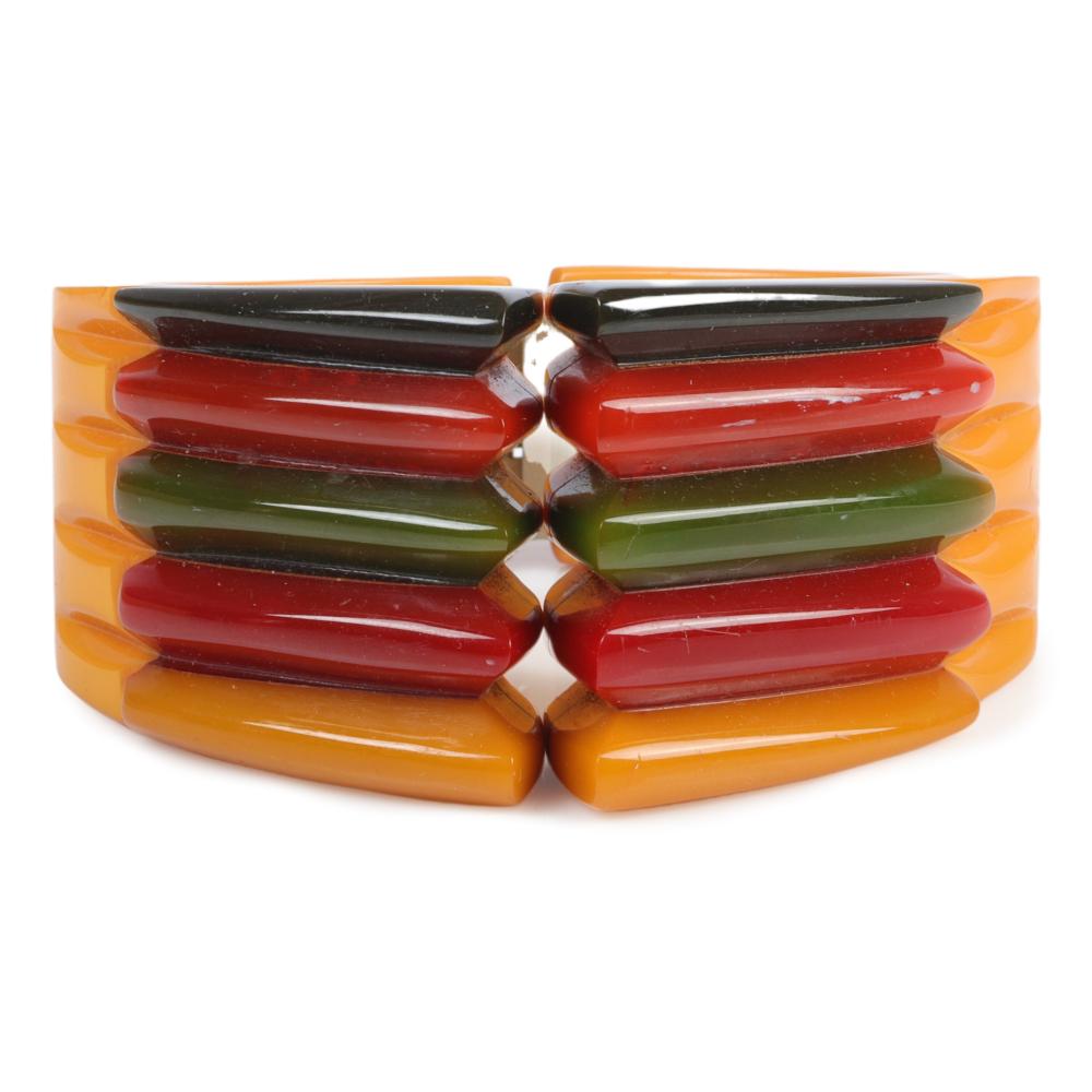 Appraisal: PHILADELPHIA BRACELET WITH -LAYER POLYCHROME BAKELITE FINS ON BUTTERSCOTCH CLAMPER