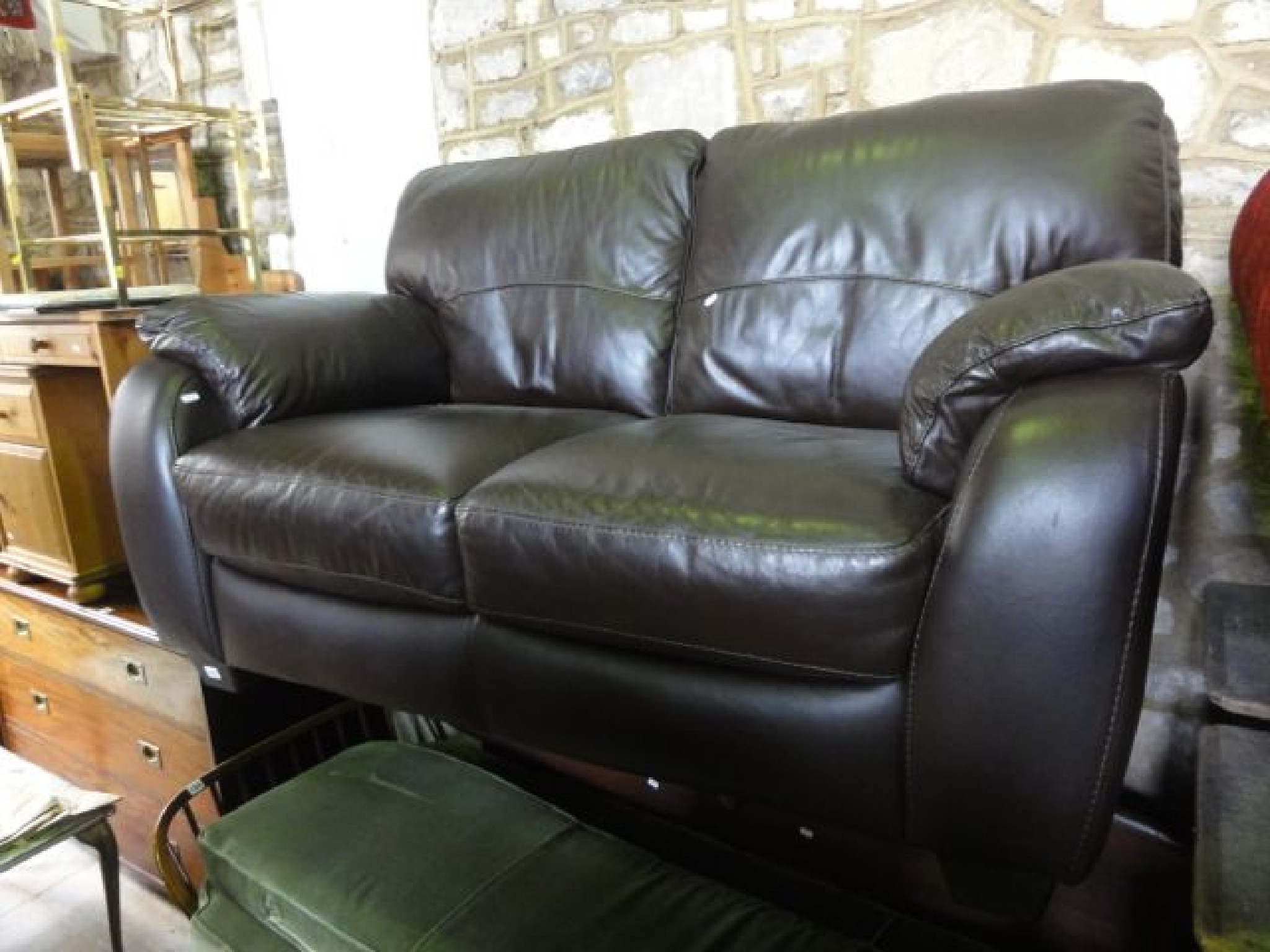 Appraisal: A modern chocolate brown soft leather upholstered -seat sofa with