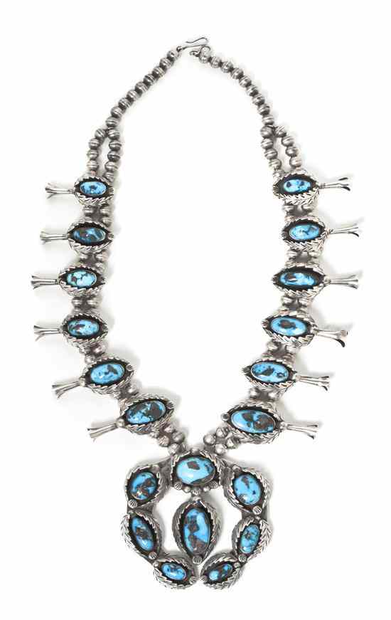 Appraisal: A Zuni Sterling Silver and Turquoise Squash Blossom Necklace with