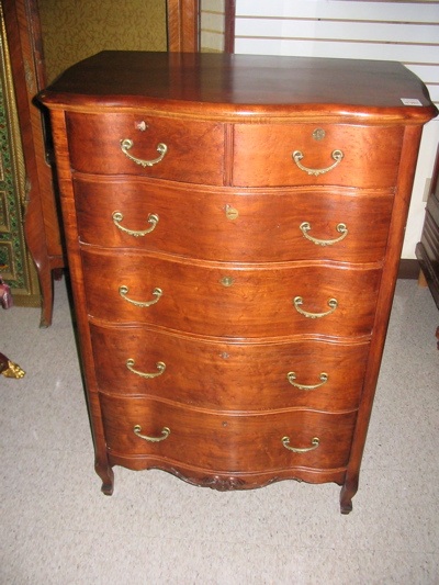 Appraisal: LATE VICTORIAN CHEST OF DRAWERS American c having a serpentine-shaped