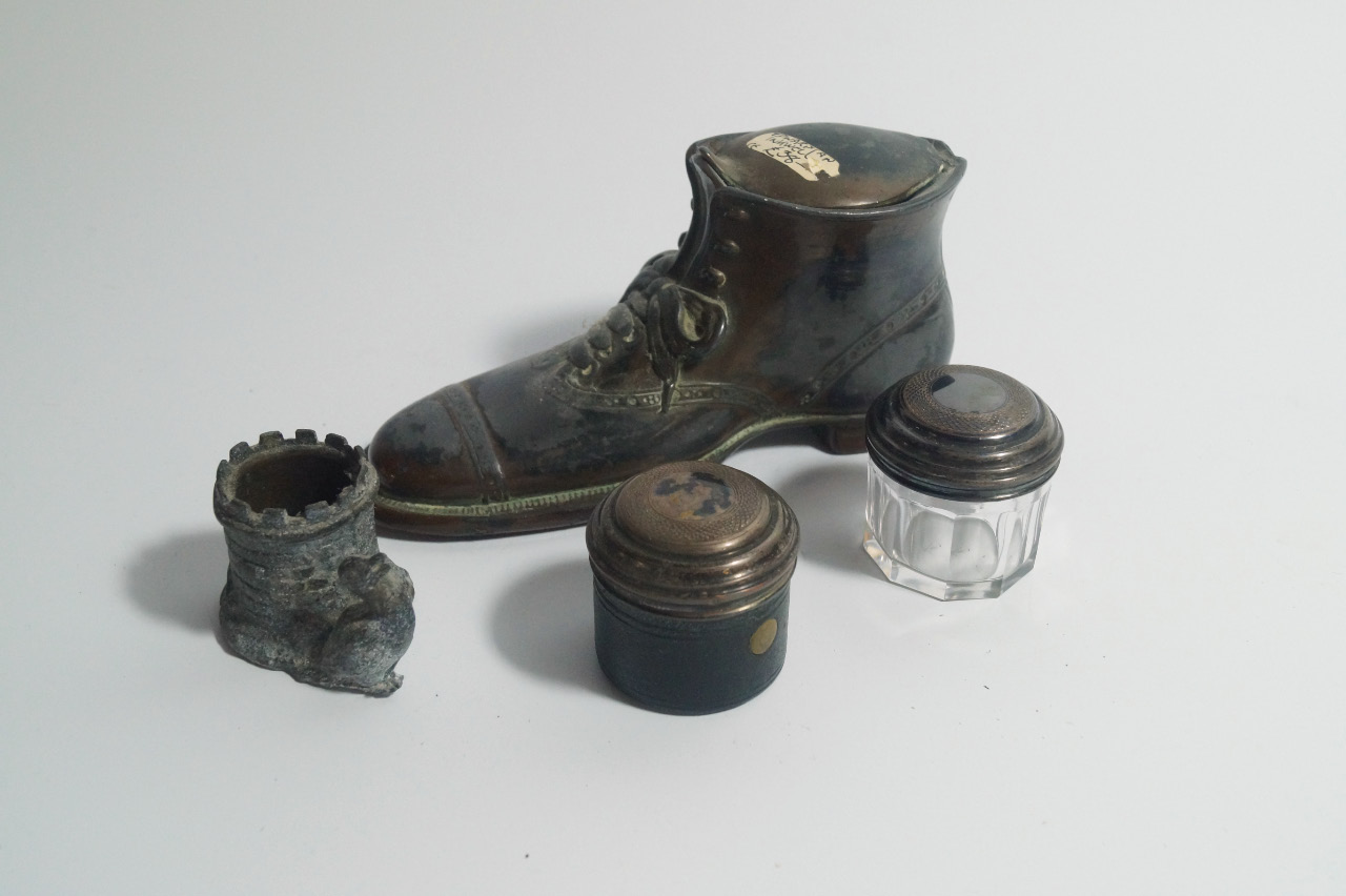 Appraisal: An Edwardian cast metal inkwell formed as a shoe two