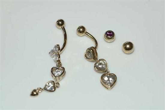 Appraisal: TWO CLEAR STONE SET BELLY RINGS STAMPED CT GOLD