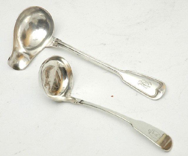 Appraisal: TWO SILVER SAUCE LADLES One Scottish Edinburgh the other Continental