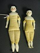 Appraisal: PAIR BISQUE DOLL HOUSE DOLLS GERMANY China head type on