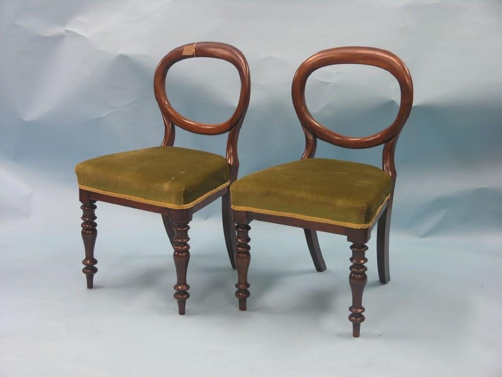 Appraisal: A set of four Victorian mahogany balloon-back dining chairs upholstered