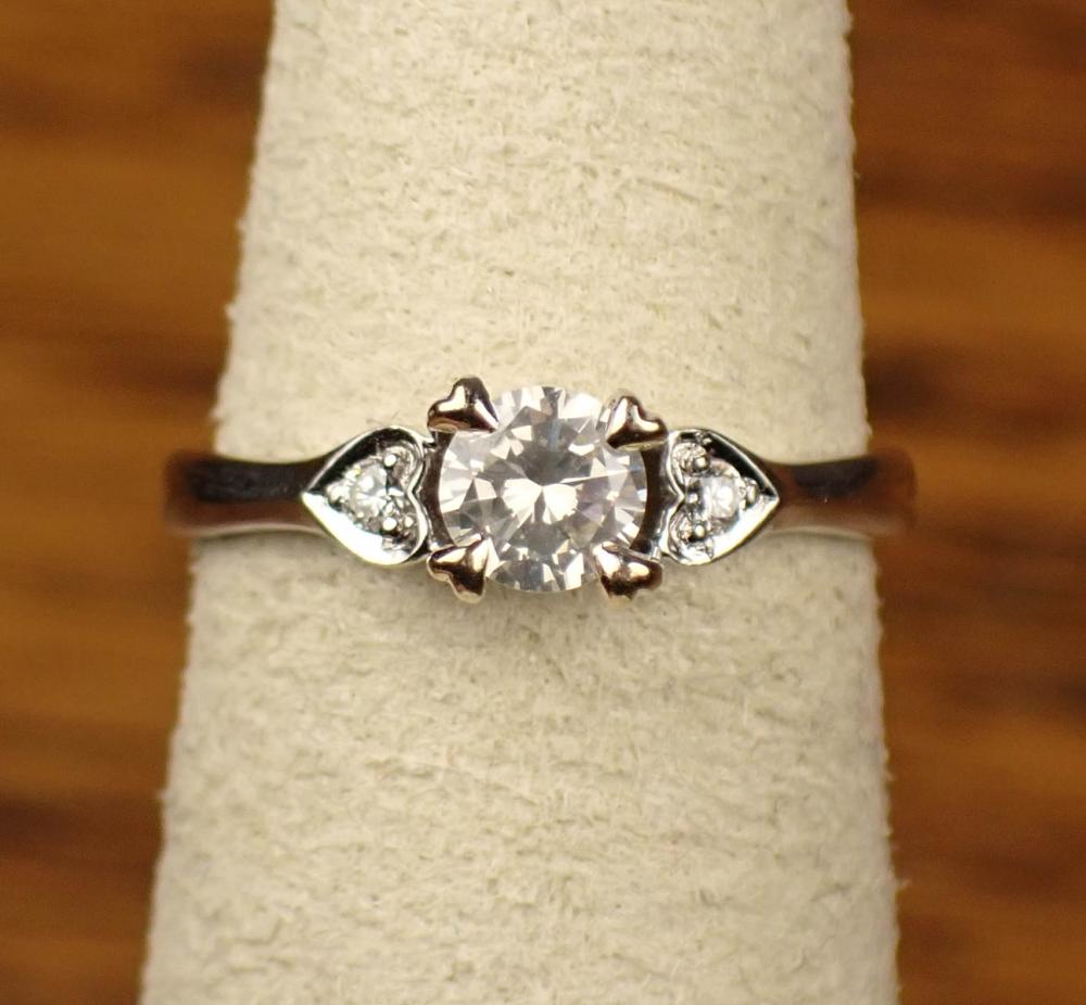 Appraisal: DIAMOND AND EIGHTEEN KARAT WHITE GOLD RING with a round