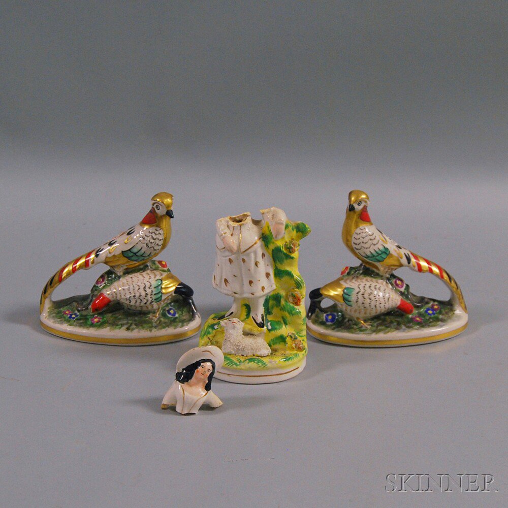 Appraisal: Three Staffordshire Ceramic Figures a pair of gilt- and paint-decorated