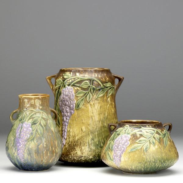 Appraisal: ROSEVILLE Wisteria three vases blue with foil label brown and