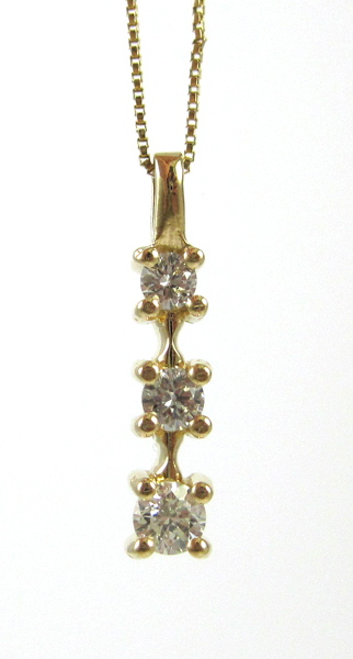 Appraisal: THREE-STONE DIAMOND PENDANT NECKLACE with a - inch k yellow