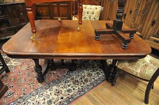 Appraisal: AN EARLY TH CENTURY OAK EXTENDING DINING TABLE WITH TWO