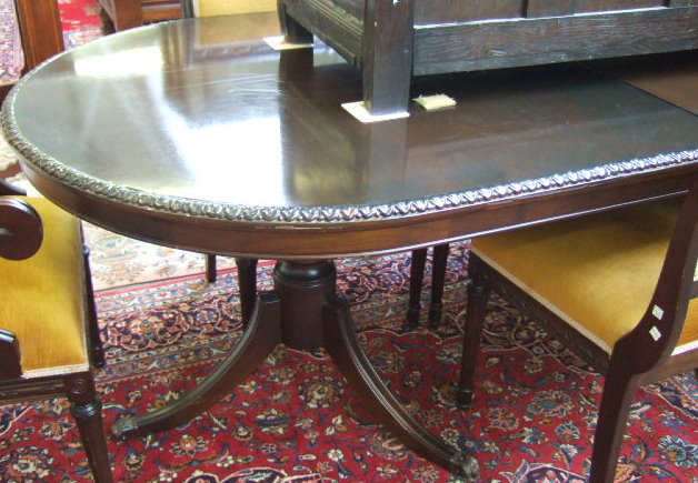 Appraisal: A th century mahogany twin pedestal dining table with integral