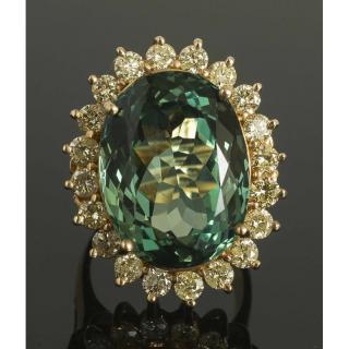 Appraisal: Teal Topaz Diamond Gold Ring k yellow gold ring containing