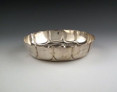 Appraisal: A silver strawberry dish by Theodore Rossi London circular fluted