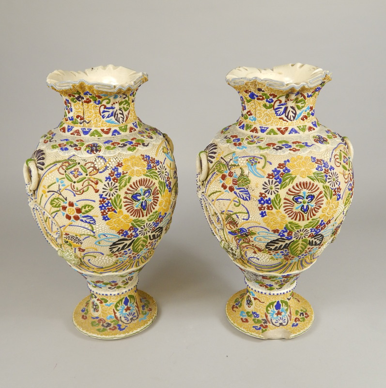 Appraisal: A pair of Japanese earthenware vases each with raised decoration