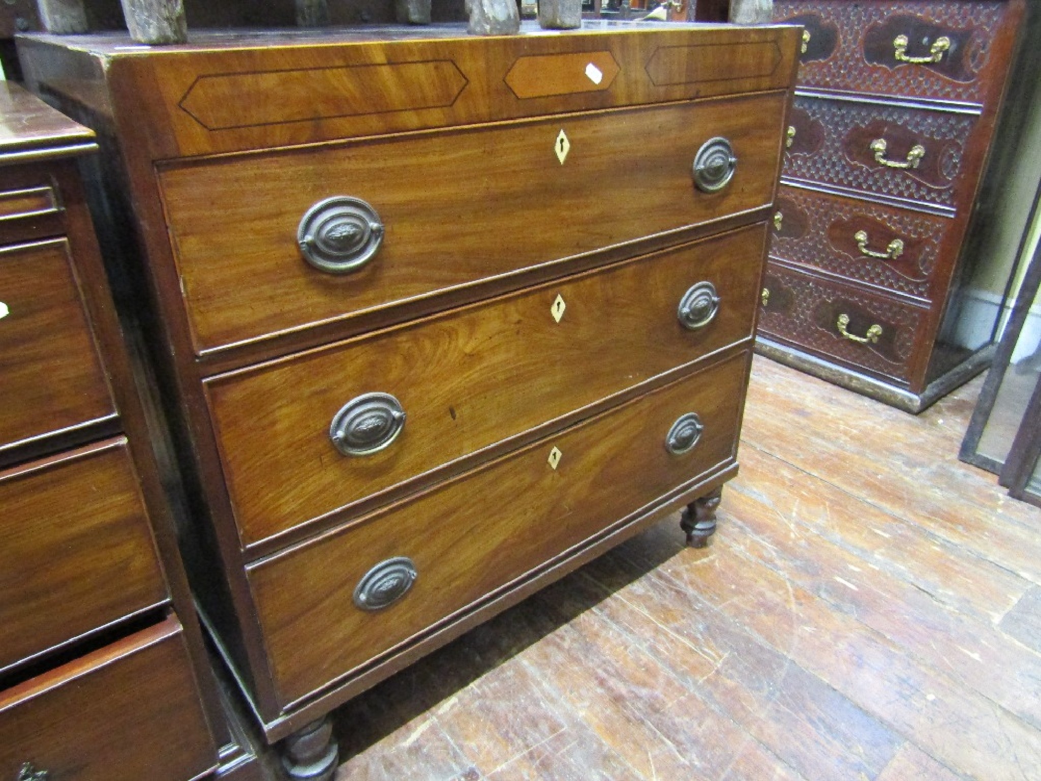 Appraisal: A small Georgian mahogany caddy top chest with cross banded