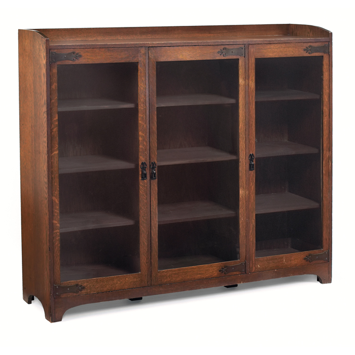 Appraisal: Arts and Crafts bookcase three-door form adjustable shelves original finish