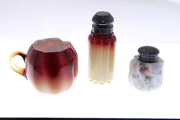 Appraisal: Three Piece Glass lot A cased Amberina salt pepper shaker