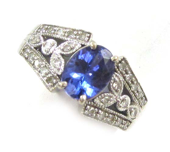 Appraisal: TANZANITE DIAMOND AND TEN KARAT WHITE GOLD RING with round-cut