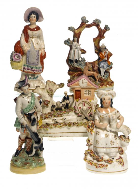 Appraisal: FIVE STAFFORDSHIRE EARTHENWARE FIGURES AND GROUPS one of the latter