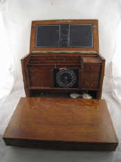 Appraisal: An oak stationery cabinet with brass Gothic strap mounts double