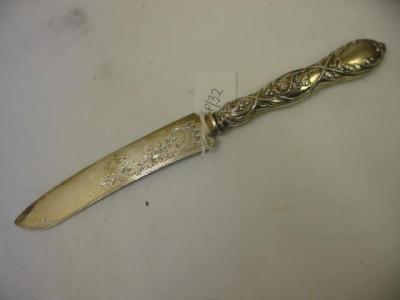 Appraisal: A VICTORIAN BREAD KNIFE the blade chased with a fruiting