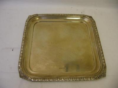 Appraisal: A TRAY of square form the rim moulded with stiff