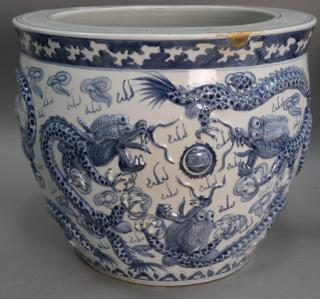 Appraisal: Large blue and white porcelain molded dragon planter fish bowl