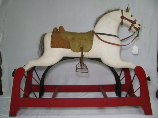 Appraisal: Hand carved and crafted child's wooden rocking horse with leather