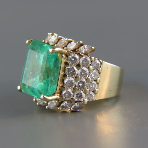 Appraisal: Emerald Diamond Ring emerald cut gem weighing carats surrounded by